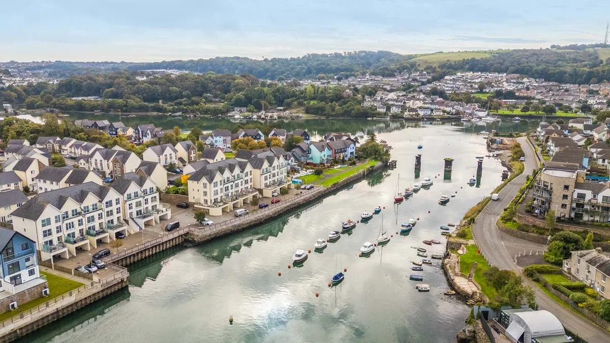 Aerial view of waterside homes and moorings near Plymstock