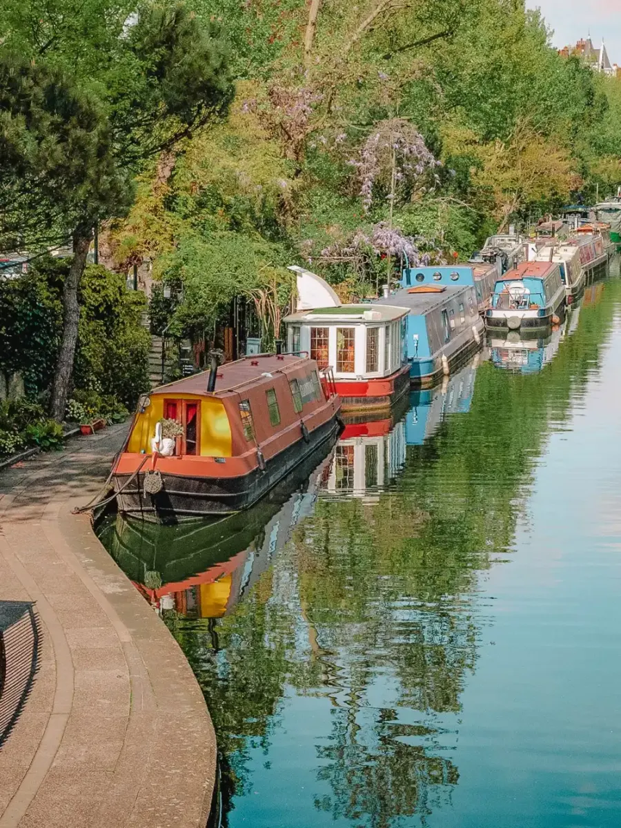 Narrowboats moored along a London canal