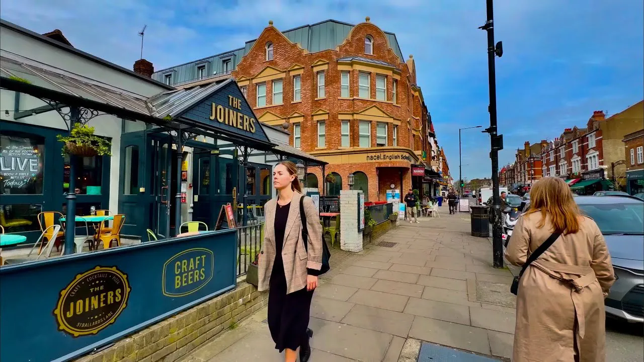 The Joiners on Ballards Lane with red-brick mansion blocks behind