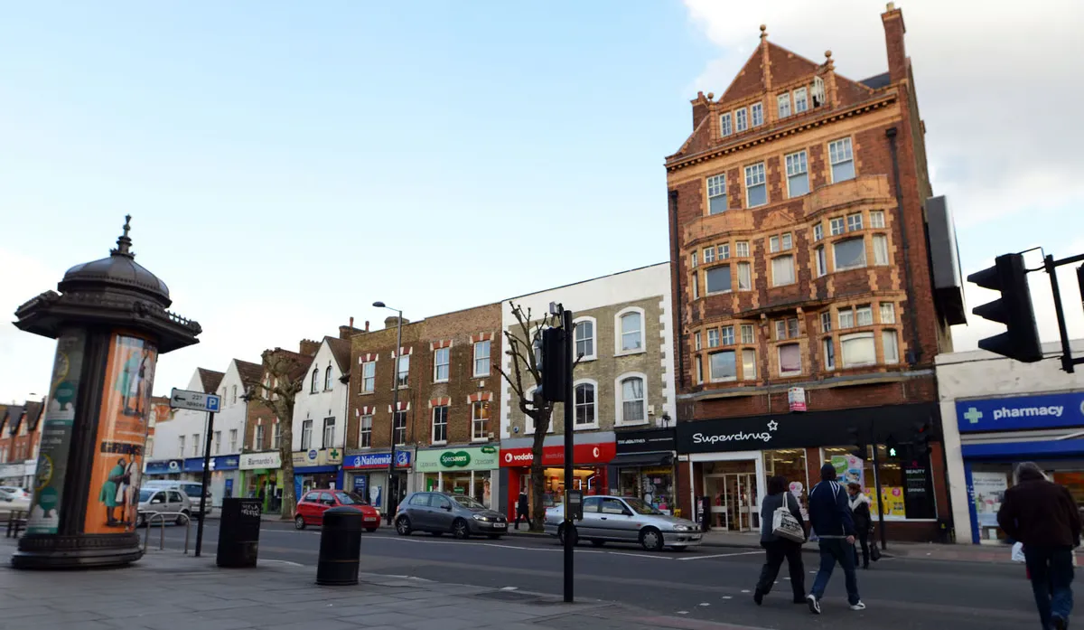 Shopfronts and pedestrians on a north London high road